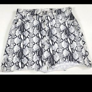 Designer brand Frame Snake Skin pattern Denim Skirt. Size 24 USA made. Raw hem.